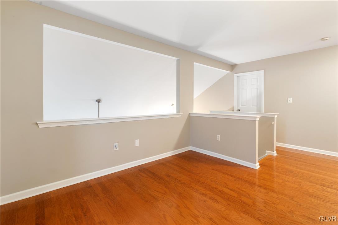 2229 Juniper Drive Coplay, PA 18037 - Photo 25 of 52 an empty room with wooden floor and windows