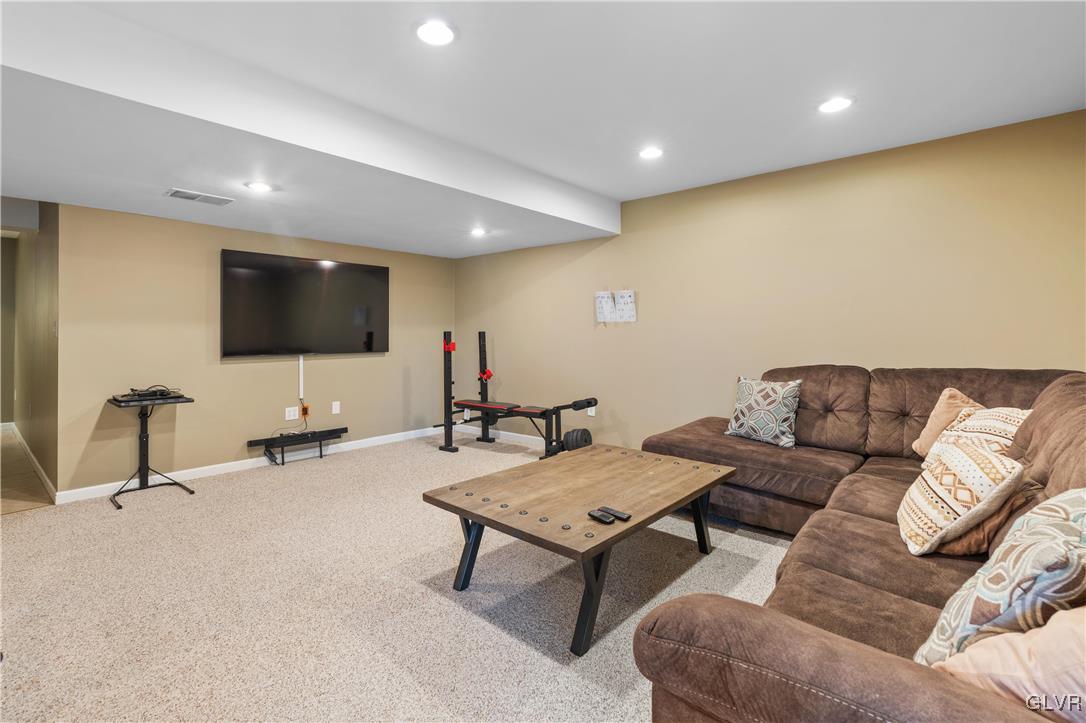 2229 Juniper Drive Coplay, PA 18037 - Photo 33 of 52 a living room with furniture and a flat screen tv