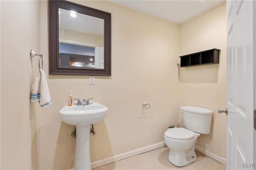 2229 Juniper Drive Coplay, PA 18037 - Photo 37 of 52 a bathroom with a toilet sink and mirror