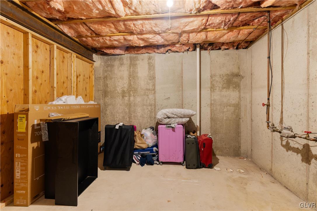 2229 Juniper Drive Coplay, PA 18037 - Photo 38 of 52 a room with a bed and a chandelier