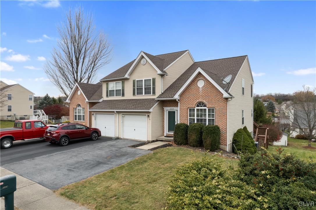 2229 Juniper Drive Coplay, PA 18037 - Photo 4 of 52 a front view of a house with cars parked