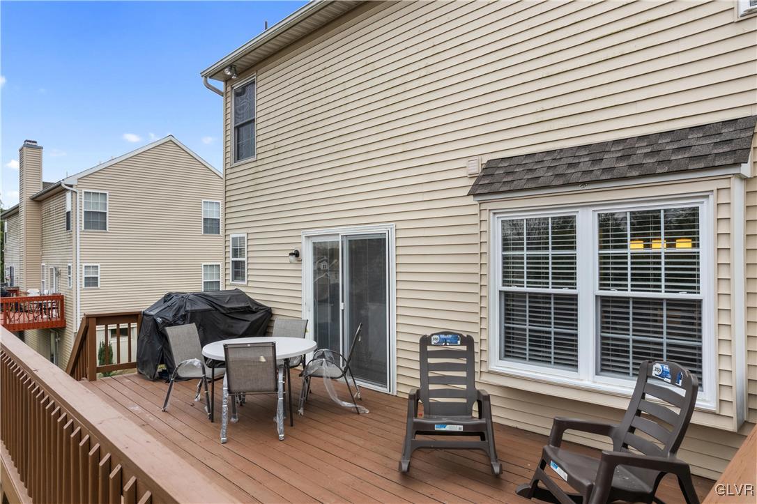 2229 Juniper Drive Coplay, PA 18037 - Photo 42 of 52 a view of a patio with table and chairs with wooden floor and fence