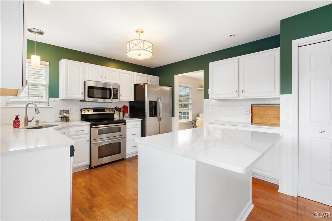 2229 Juniper Drive Coplay, PA 18037 - Photo 5 of 52 a kitchen with stainless steel appliances a stove sink microwave and refrigerator
