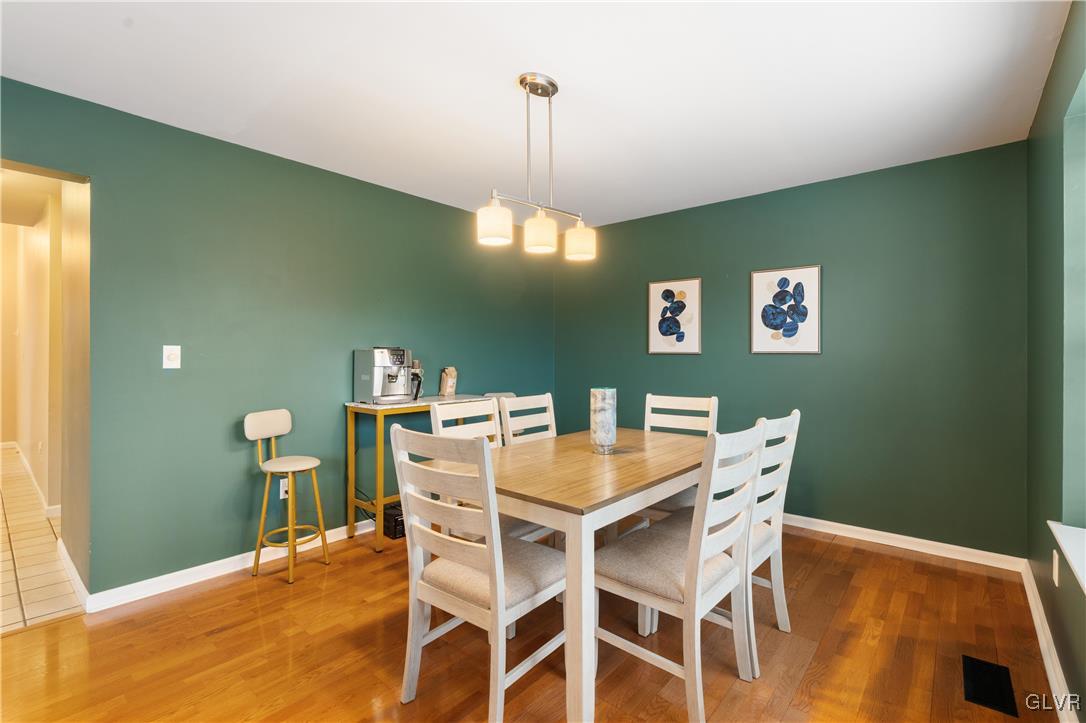 2229 Juniper Drive Coplay, PA 18037 - Photo 9 of 52 a view of a dining room with furniture and wooden floor