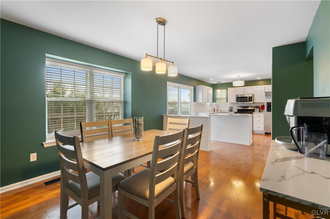2229 Juniper Drive Coplay, PA 18037 - Photo 10 of 52 a dining room with furniture and a floor to ceiling window