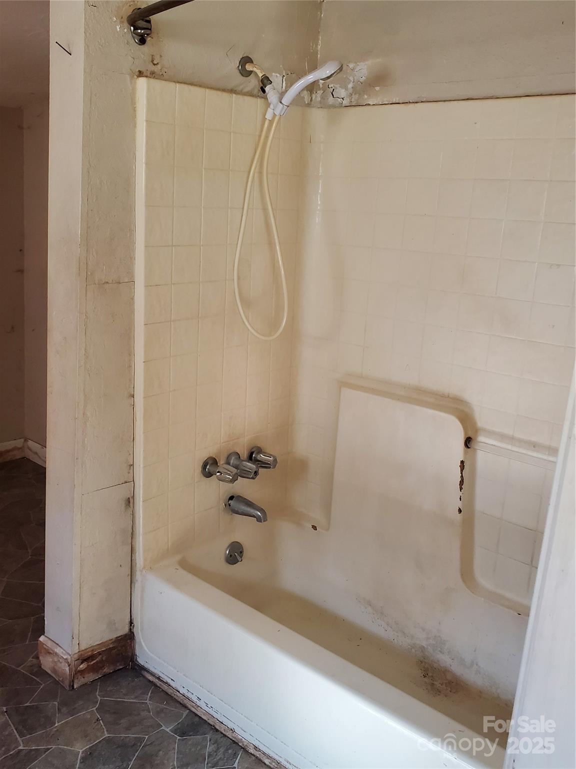 414 South Rowan Avenue Spencer, NC 28159 - Photo 12 of 15 a bathroom with a shower and a bath tub