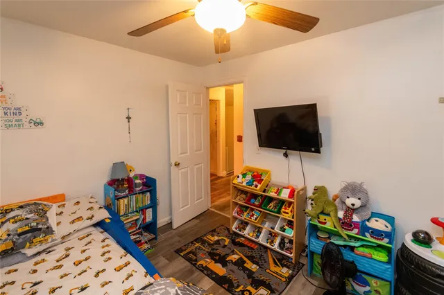 a room with toys and a flat screen tv