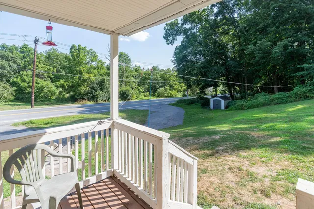 a picture of a bathroom with a white wall and a picture