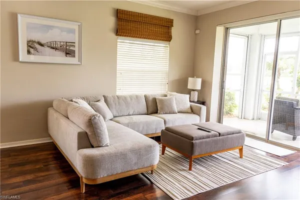a living room with granite countertop furniture and a window