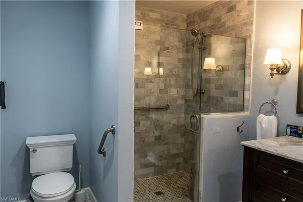 a bathroom with a sink vanity and a mirror