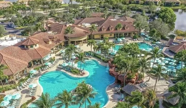 an aerial view of residential houses with outdoor space and street view