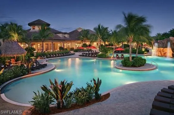 an aerial view of residential house with outdoor space and lake view