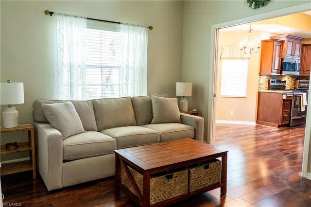 a kitchen with granite countertop wooden cabinets and a stove top oven
