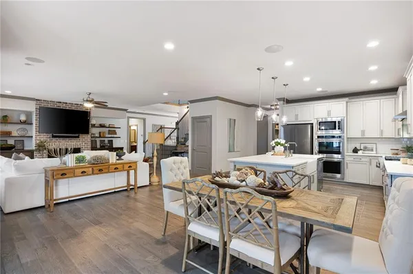 a bathroom with a tub a sink and a mirror