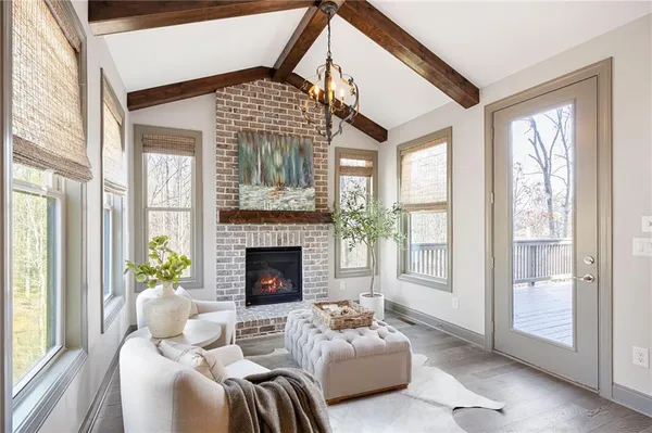 a large kitchen with stainless steel appliances granite countertop a large counter top and a wooden floors