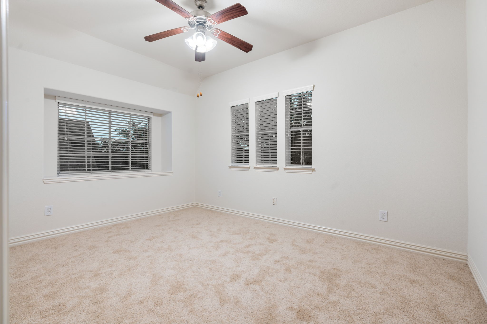 307 Arbor Ridge Lane Conroe, TX 77384 - Photo 31 of 50 an empty room with a window and a ceiling fan