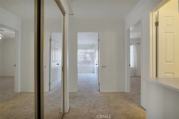 an empty room that has a mirror in it