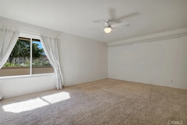 a view of an empty room with a window