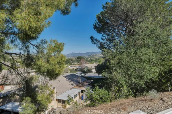 a balcony with table and chairs