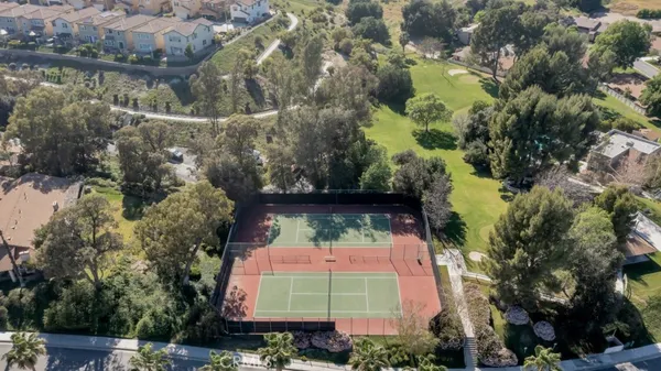 an aerial view of a house with a garden