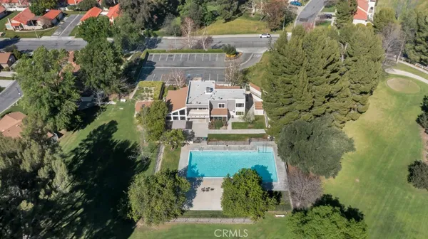 an outdoor space with furniture and garden