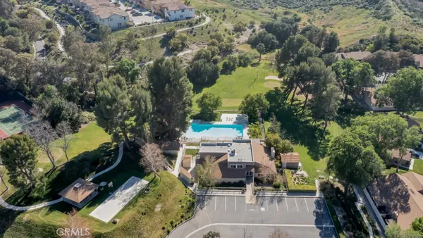 an aerial view of a house with a yard