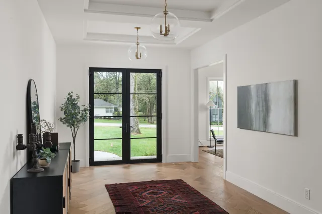 a view of a livingroom with furniture and a potted plant