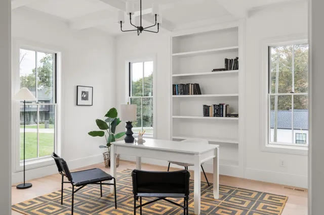 a view of a room that has a table and chair