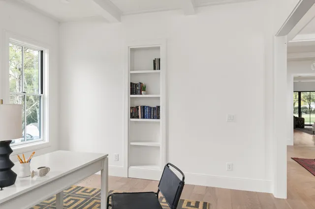 a dining room with furniture and window