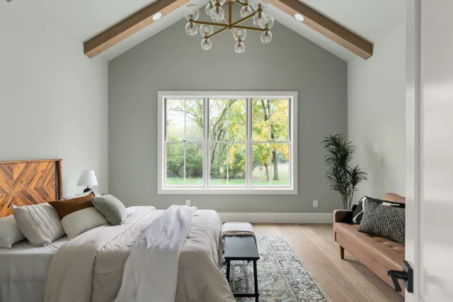 a bathroom with a bathtub sink and mirror