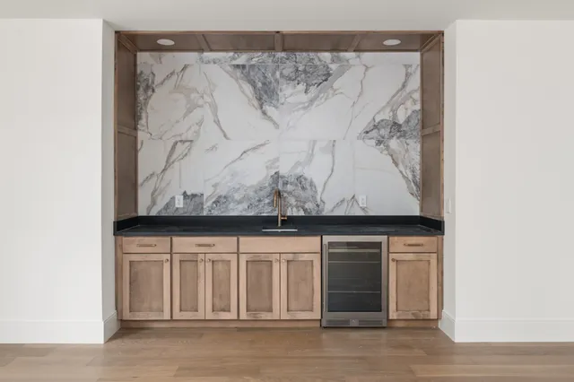 a bathroom with a toilet a sink and bathtub