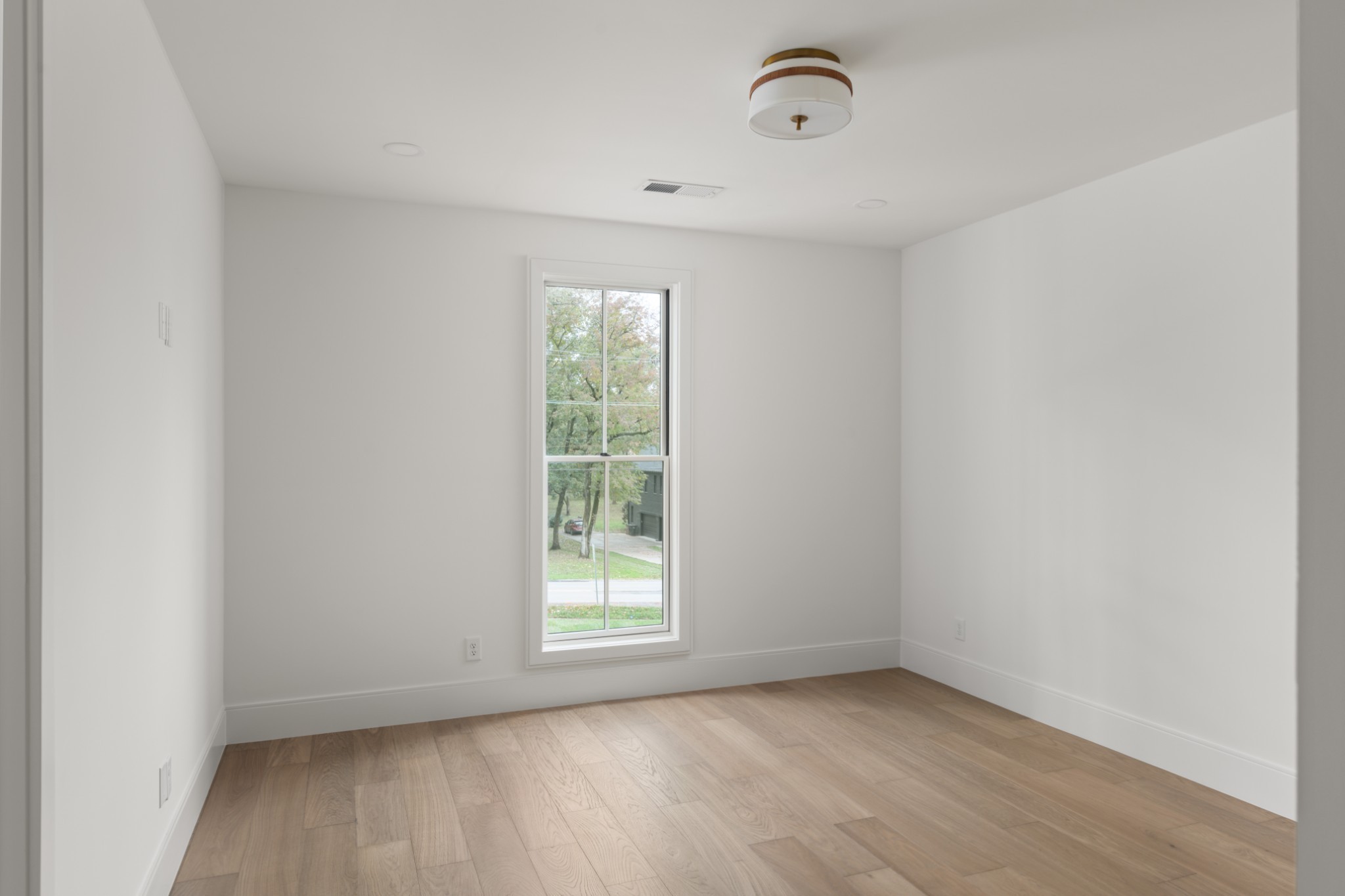 706 Brook Hollow Road Nashville, TN 37205 - Photo 42 of 55 an empty room with wooden floor and windows