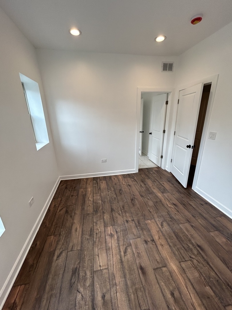 6016 South St Lawrence Avenue, Unit 1 Chicago, IL 60637 - Photo 11 of 16 a view of empty room with wooden floor