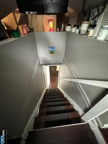 a view of a patio with table and chairs next to a yard