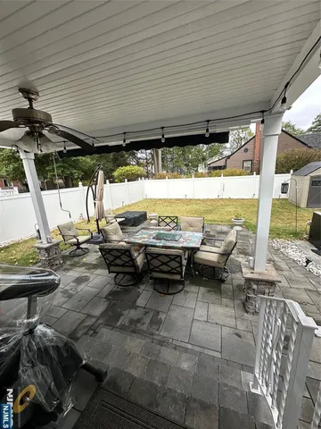 a view of a swimming pool with a patio