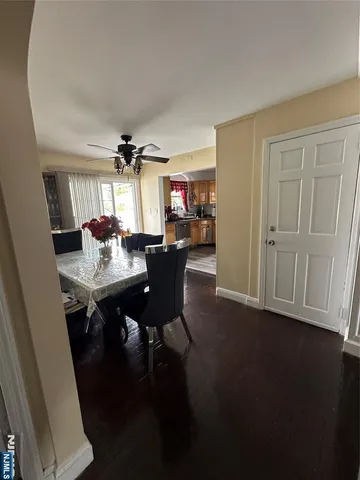 a view of a dining room with furniture and chandelier