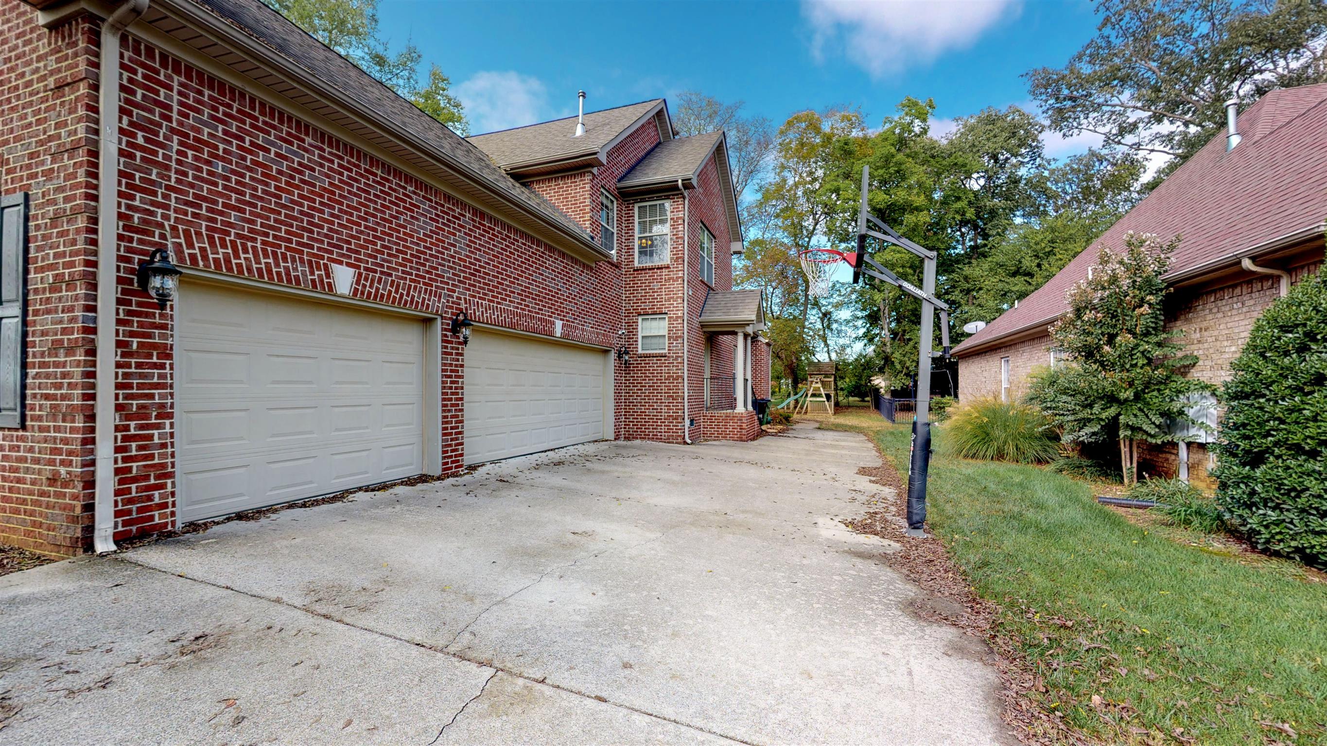 5344 Sherrington Road Murfreesboro, TN 37128 - Photo 2 of 24 3 car side-entry garage