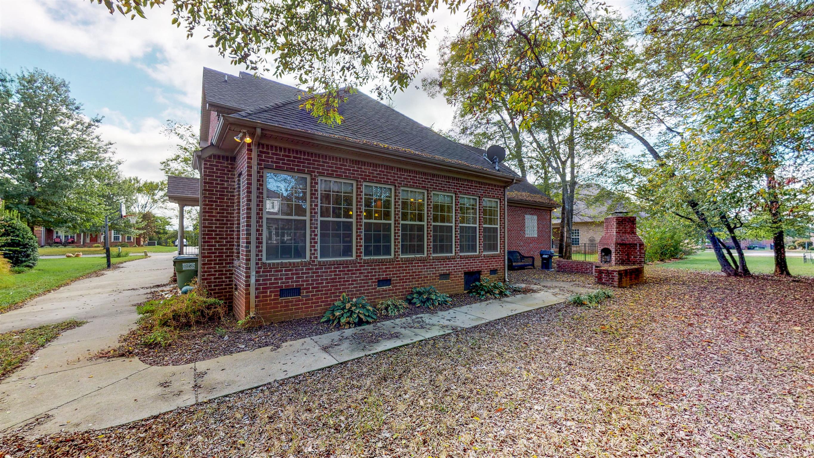 5344 Sherrington Road Murfreesboro, TN 37128 - Photo 3 of 24 Paved walkway to patio with outdoor wood burning fireplace