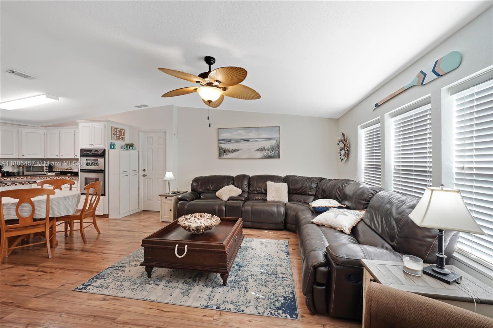 945 Plantation Road, Unit 945 Key Largo, FL 33037 - Photo 14 of 66 a living room with furniture and wooden floor