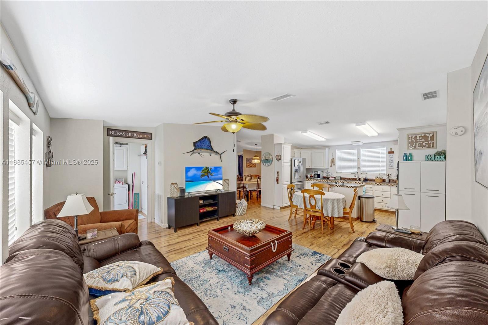 945 Plantation Road, Unit 945 Key Largo, FL 33037 - Photo 15 of 66 a living room with furniture and a chandelier