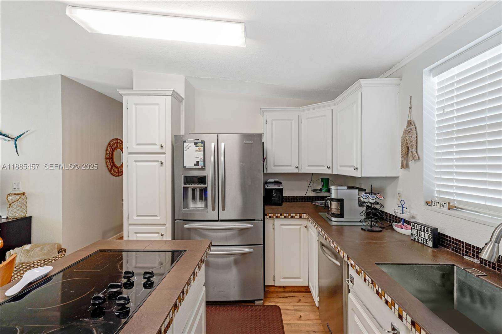 945 Plantation Road, Unit 945 Key Largo, FL 33037 - Photo 17 of 66 a kitchen with a sink stove and refrigerator