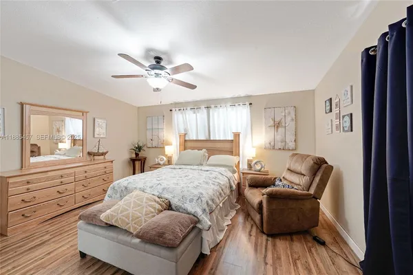 a white bath tub sitting next to a white sink