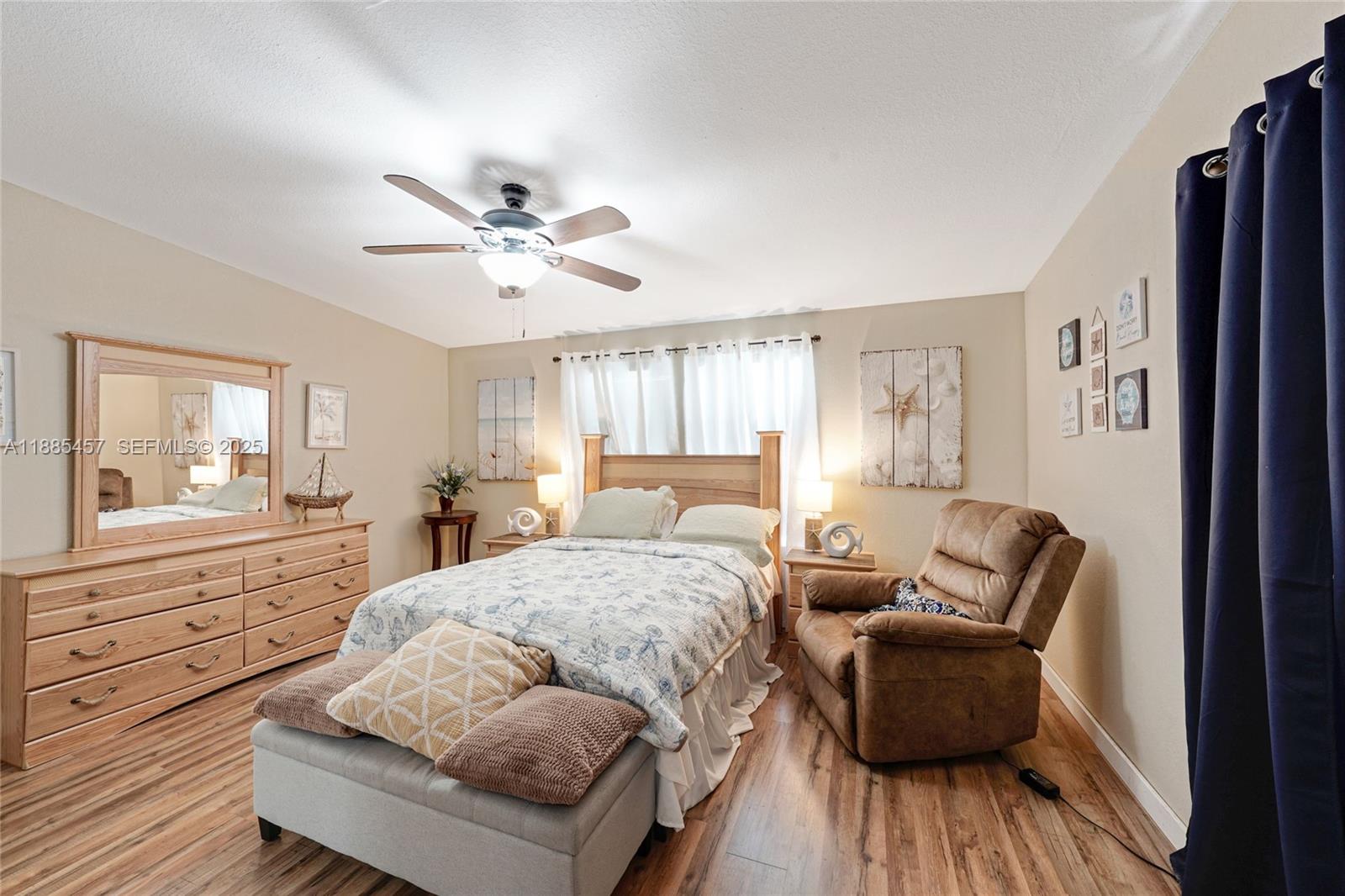 945 Plantation Road, Unit 945 Key Largo, FL 33037 - Photo 18 of 66 a bedroom with a bed and wooden floor