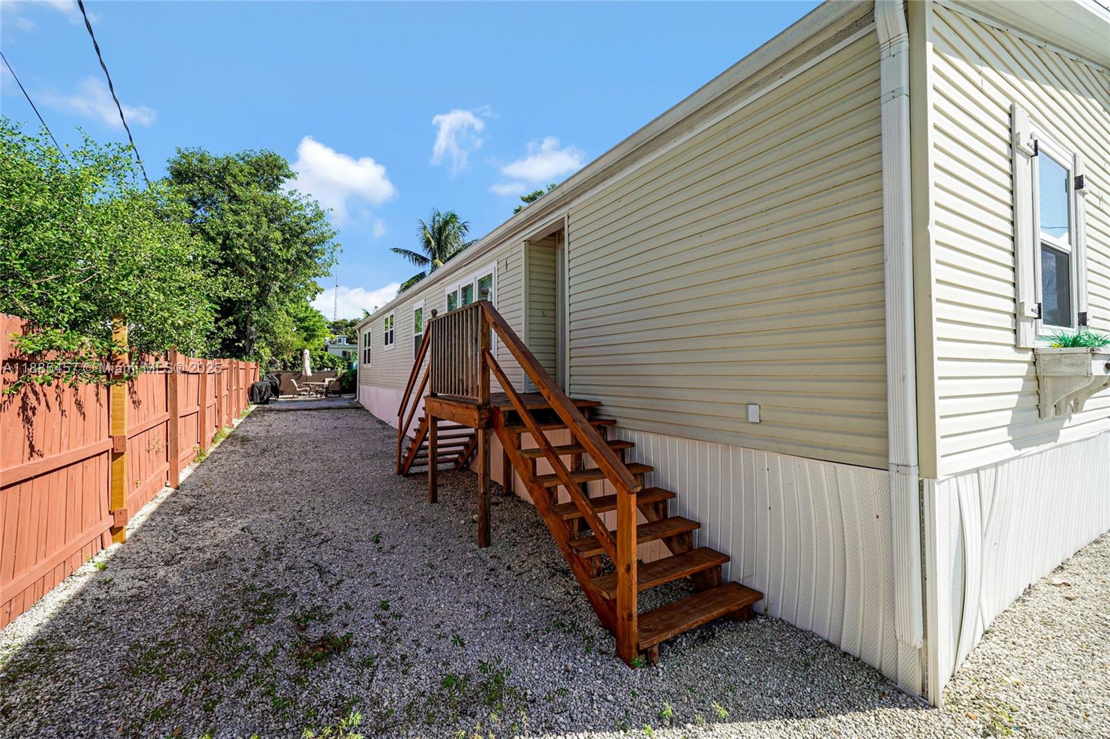 945 Plantation Road, Unit 945 Key Largo, FL 33037 - Photo 2 of 66 a view of a house with a yard