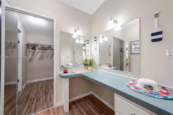a bathroom with a double vanity sink and a mirror