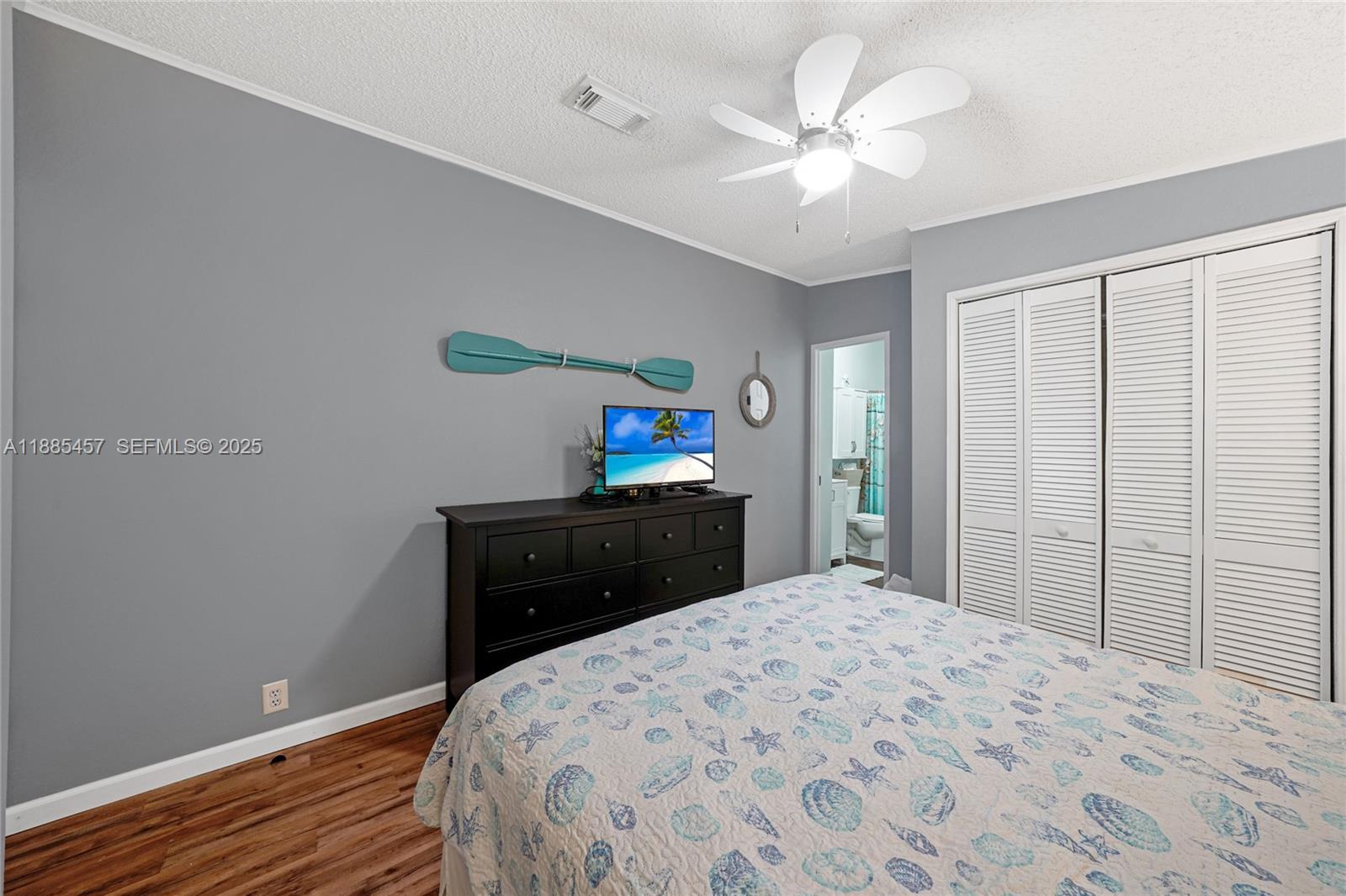 945 Plantation Road, Unit 945 Key Largo, FL 33037 - Photo 30 of 66 a bedroom with a bed and a dresser