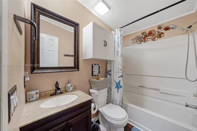a view of a house with wooden fence