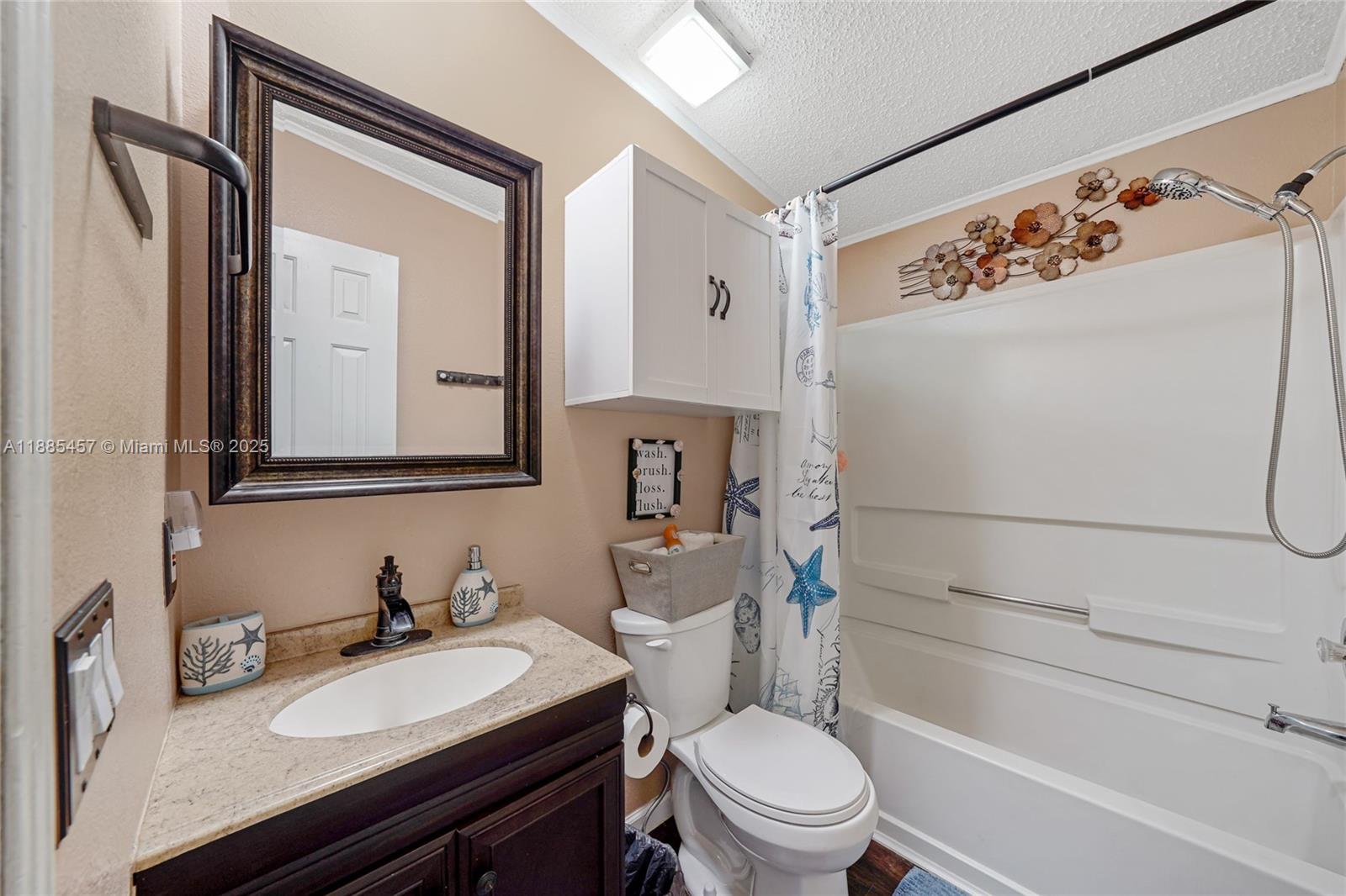 945 Plantation Road, Unit 945 Key Largo, FL 33037 - Photo 35 of 66 a bathroom with a granite countertop sink toilet and shower
