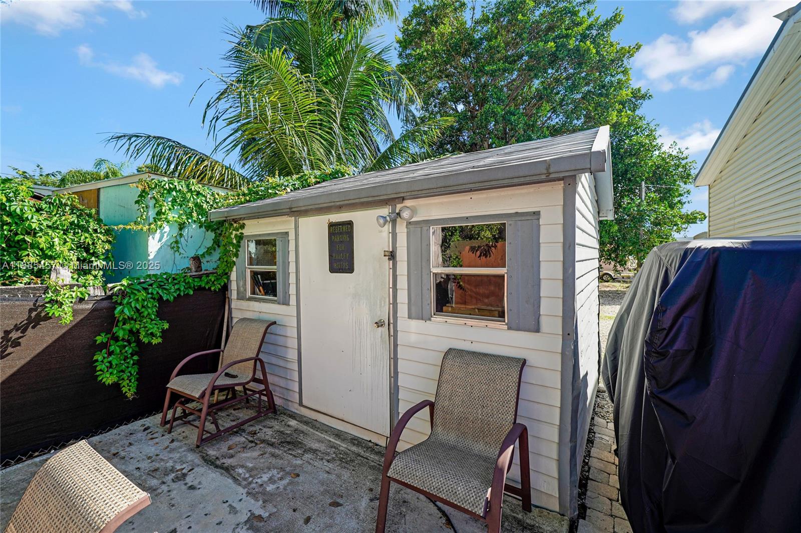945 Plantation Road, Unit 945 Key Largo, FL 33037 - Photo 39 of 66 a view of backyard with outdoor seating and plants