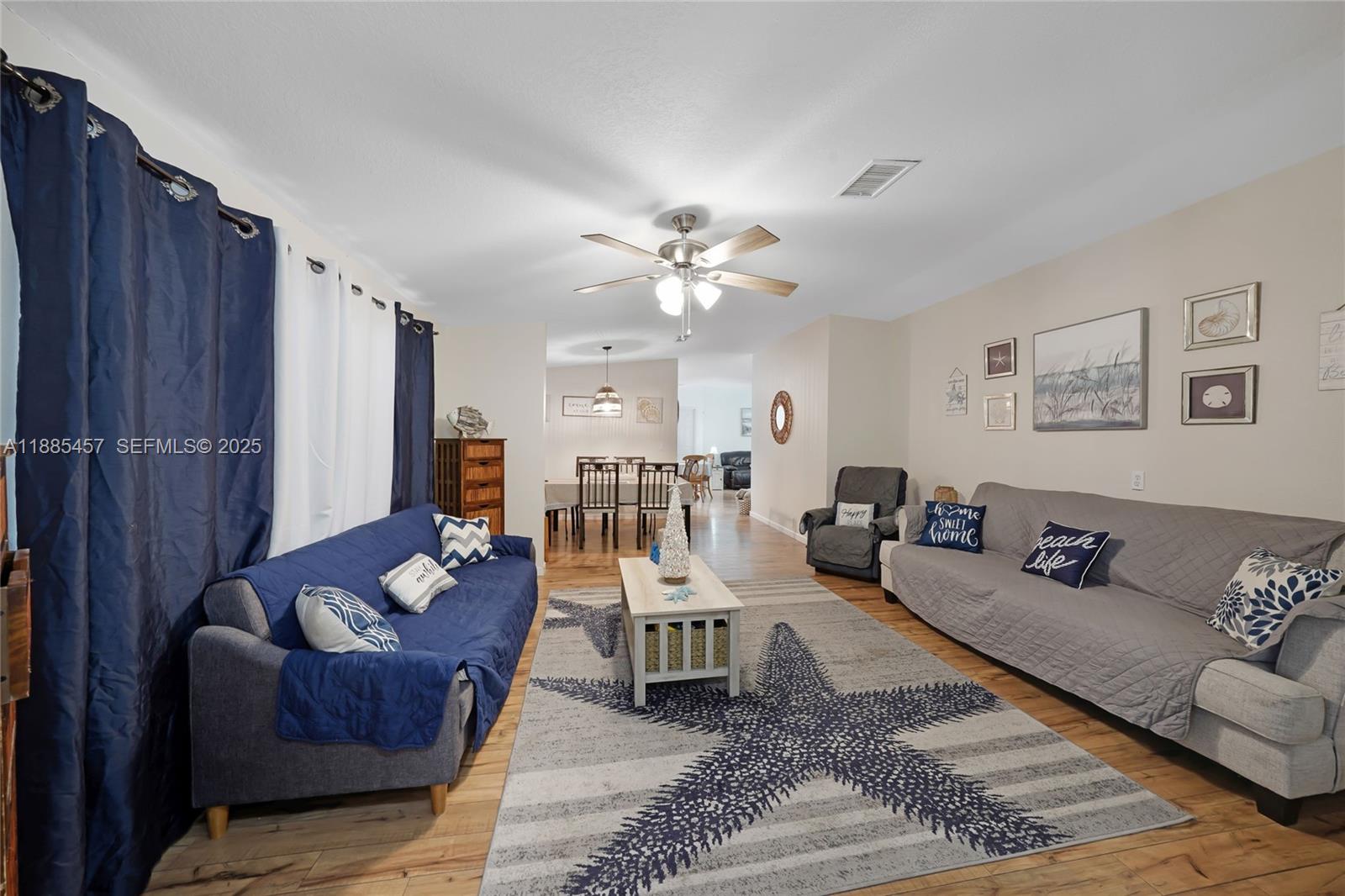 945 Plantation Road, Unit 945 Key Largo, FL 33037 - Photo 4 of 66 a living room with furniture ceiling fan and a rug